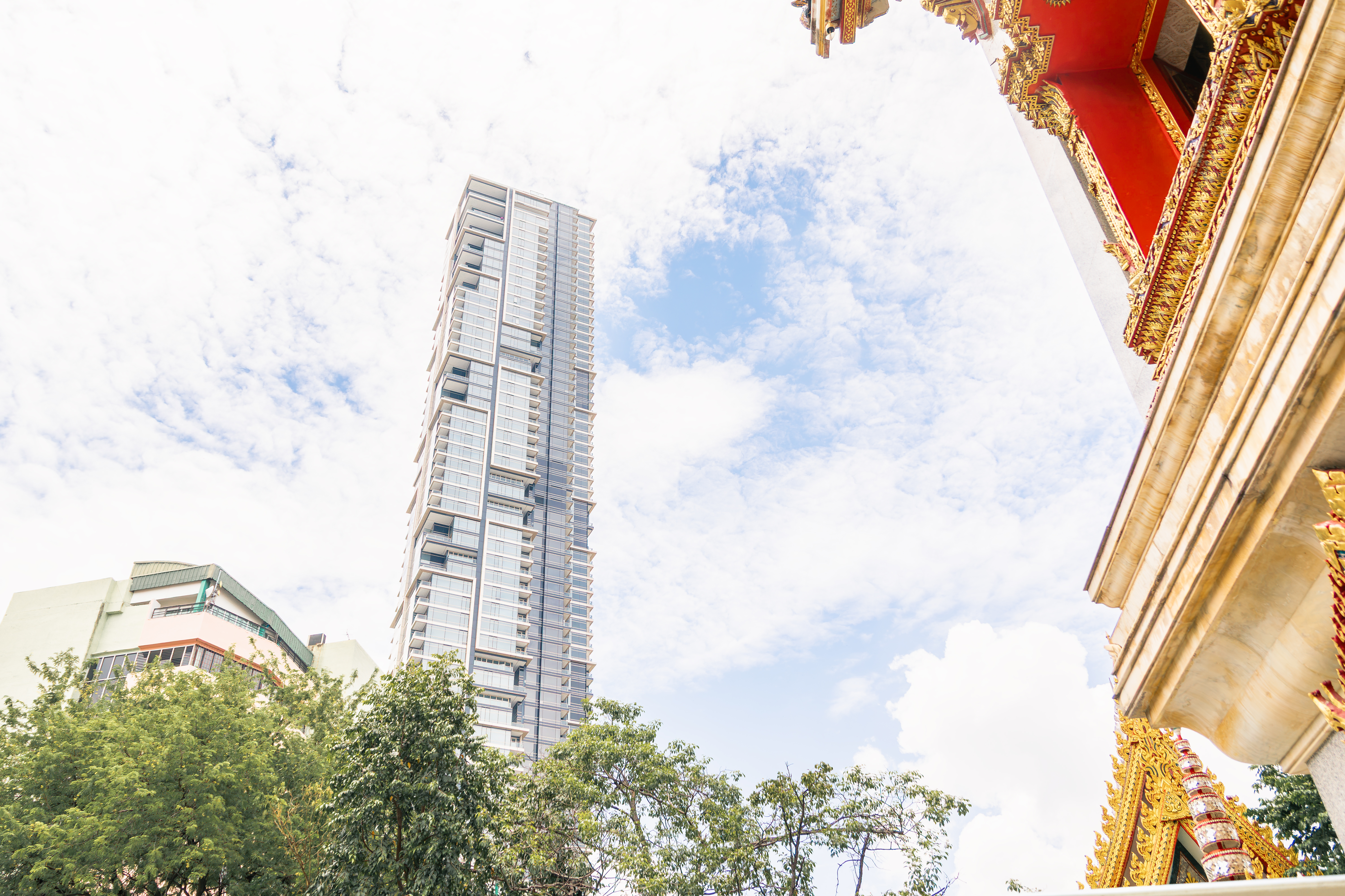 High-rise contrast — glass towers behind the temple roof